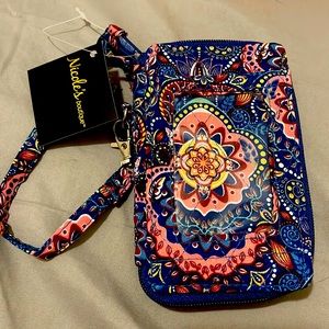 Wristlet brand new still has tag on size 31/2”x53/4”x1/2”